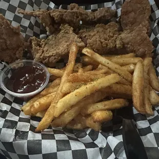 Fried ribs with fries tossed in Addy seasoning