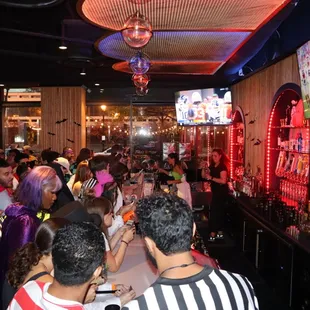 a large group of people at a bar