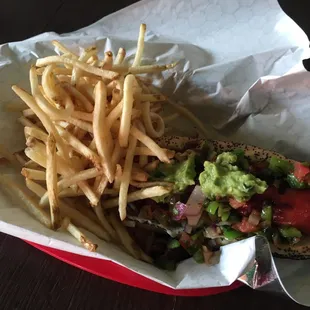 Sonoran-style hotdog and shoestring fries. Not as spicy as it sounds, maybe ask for extra jalapeños or hot sauce to kick it up.