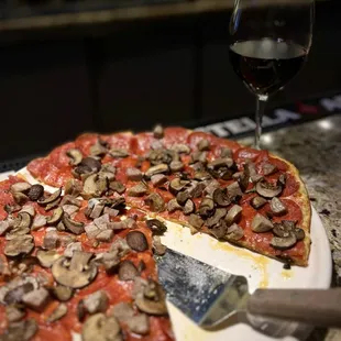 Pepperoni &amp; Sausage Pizza with a glass of Forty One