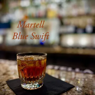 a glass of blue swift