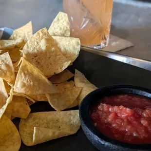 Chips and salsa and Renegade cocktail