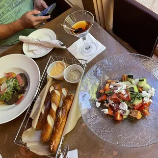 Bavarian pretzel sticks, short ribs , panzanella salad and a Manhattan