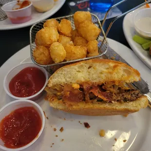 cheeseburger with bacon and onions, and a side of tots