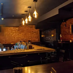 a bar with several glasses on the counter