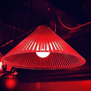 a red lamp hanging from the ceiling