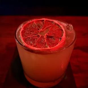 a blood orange cocktail in a glass