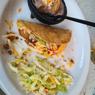 There were two tacos here, but one of them is in my belly now.