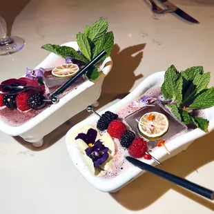 two dishes of fruit and ice cream