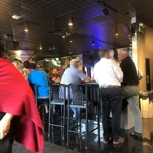 people sitting at the bar