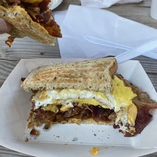 a half eaten breakfast sandwich