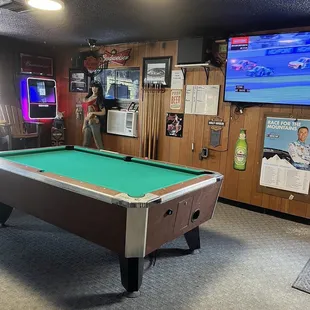 a pool table in a game room