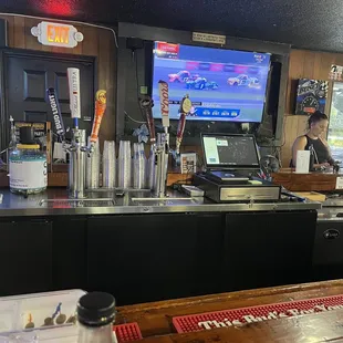 a bar with a television in the background