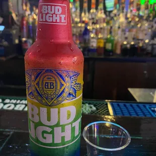 a bottle of bud light on a bar
