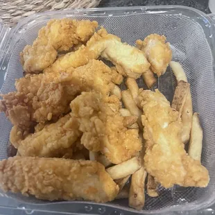 Chicken tender with a hardly any fries