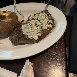 Steak and potatoes with blue cheese