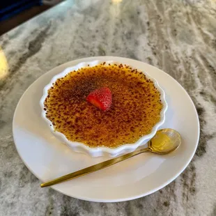 Crème Brûlée: baked Vanilla Bean Custard with a Caramelized shell