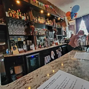 a woman pouring a drink
