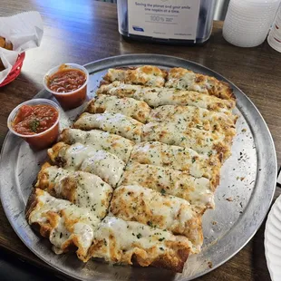 Large order of the Cheezy Garlic bread... yes thats a LARGE pizza pan! tender and crispy. great stuff!