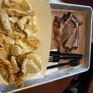 a plate of chips and a plate of meat
