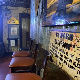 a row of chairs in a bar