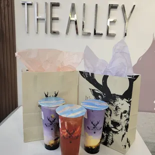 Two ube boba brown sugar crème brûlées and a strawberry green tea.