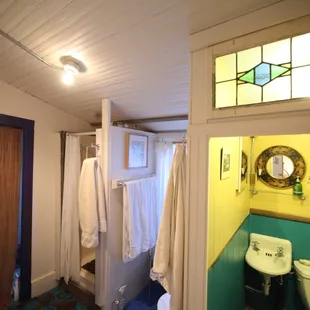 The bathroom with shower and separate toilet
