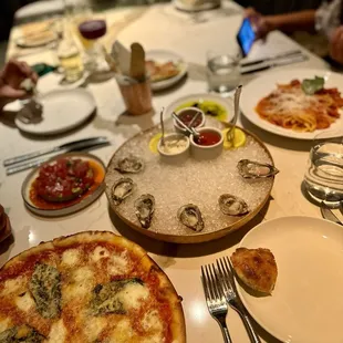 Oyster, tuna tartare, pizza, pasta, and focaccia