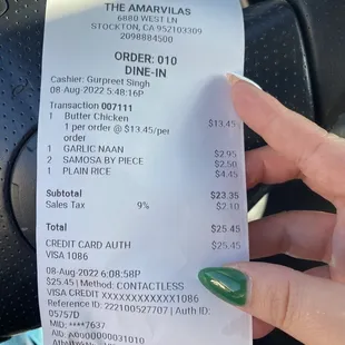 Reciept, $4.45 for a side of plain white rice.. entrees do not come with rice. Skip rice and get more naan