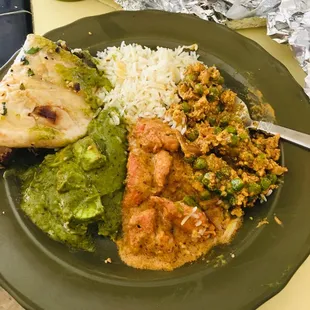 Saag Paneer (palak paneer), Chicken Makhanwala (butter chicken), Keema gobi (cauliflower) Biryani (rice) and garlic naan!