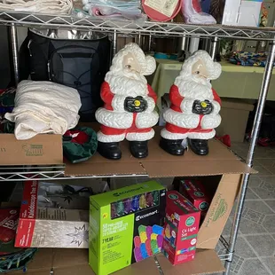 santa figurines on a shelf
