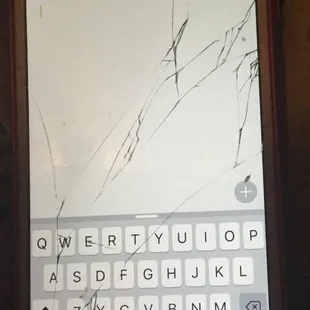Broken iPhone 6 after being assaulted there by bartender Sara