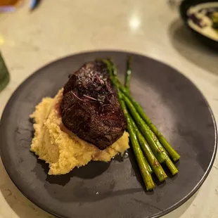 9oz. PRIME FILET MIGNON:  garlic mashed potatoes, asparagus, steak butter, roasted garlic