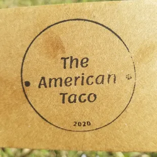 a hand holding a piece of paper