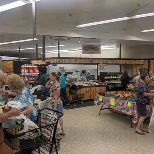 people shopping in a grocery store