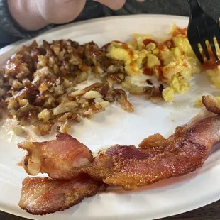 Hash browns, crisped to perfection.  Eggs and bacon.
