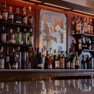 bottles of alcohol lined up on the bar