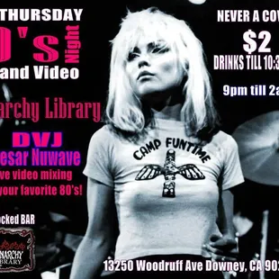 a woman in a white t - shirt and a microphone