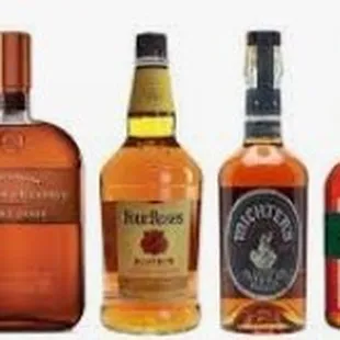 a row of different bottles of whiskey