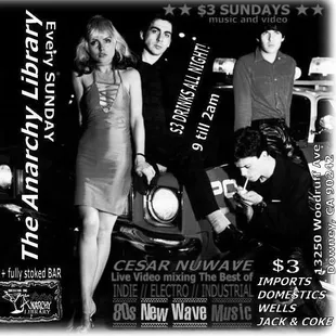 a group of people standing in front of a car