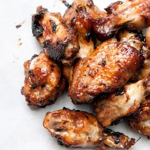 Take-and-Make house-marinated raw chicken wings are available in a variety of flavors.