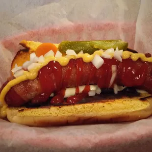 a hot dog with onions and ketchup