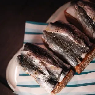 Local anchovy edamame toast