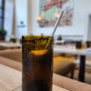 a drink in a glass on a table