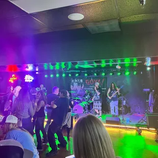 a group of people dancing in a club