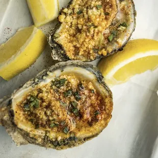 Char grilled oysters with Cajun butter, chives, and Cajun seasoning