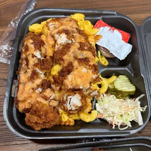 combo #4: two hot chicken tenders over a buttery rice topped w/ slaw, pickles