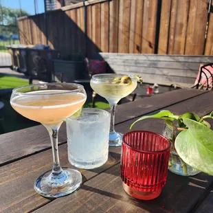 two glasses of wine and a glass of lemonade