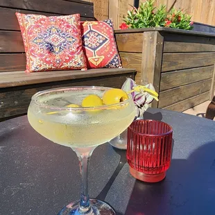 a glass of lemonade on a table