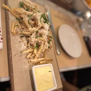 a plate of pasta with parmesan cheese
